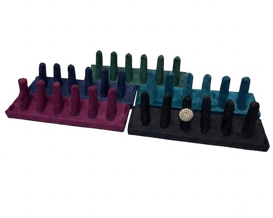velvet 6-slot ring display stand for jewelry store display with decorative pearl ring showcased on soft velvet holder.