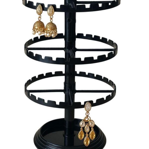 Black plastic 360-degree rotating 3-tier earring display stand with circular slotted rings for organizing and showcasing stud, hoop, hook, drop, and dangle earrings.