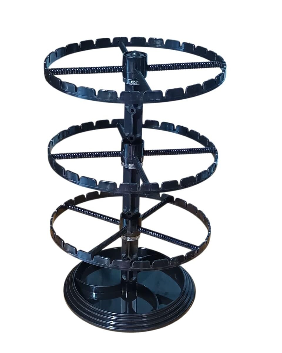 Black plastic 360-degree rotating 3-tier earring display stand with circular slotted rings for organizing and showcasing stud, hoop, hook, drop, and dangle earrings.