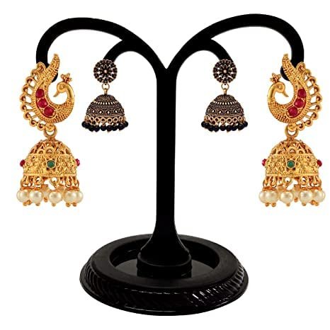 Black plastic 4-hole earrings display stand displaying multiple pairs of fashion earrings.